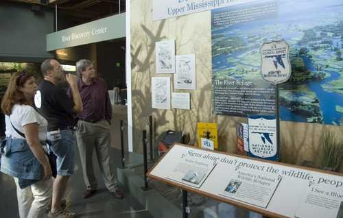 Visitors reading interpretive panels in a gallery at the National Mississippi River Museum & Aquarium, Dubuque, Iowa